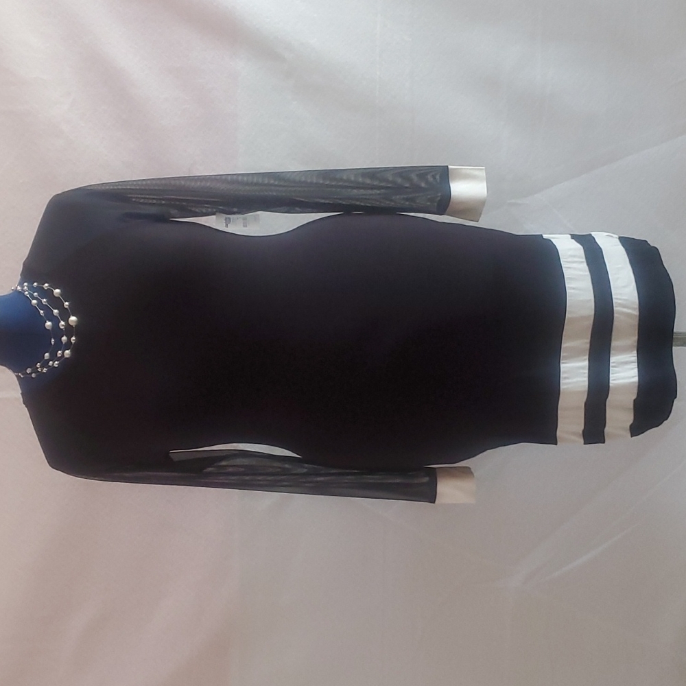 Women bodycon long sleeve chiffon and stretch knit black and cream dress.